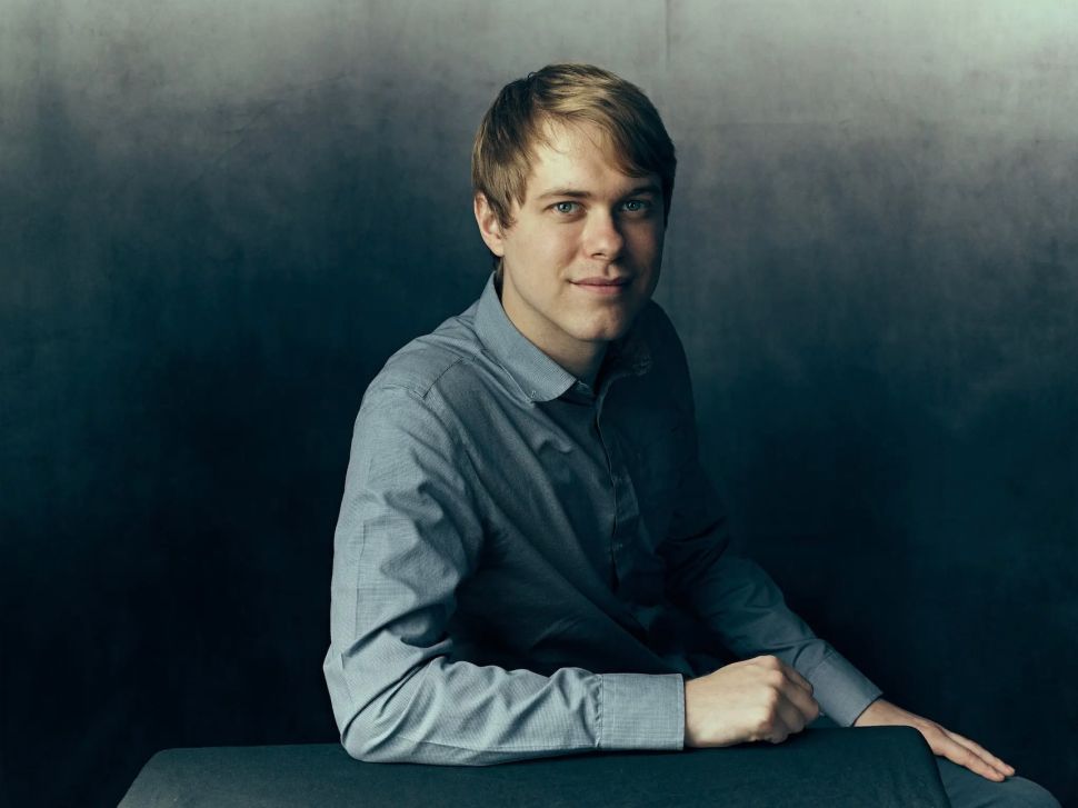 Man in light blue button up shirt