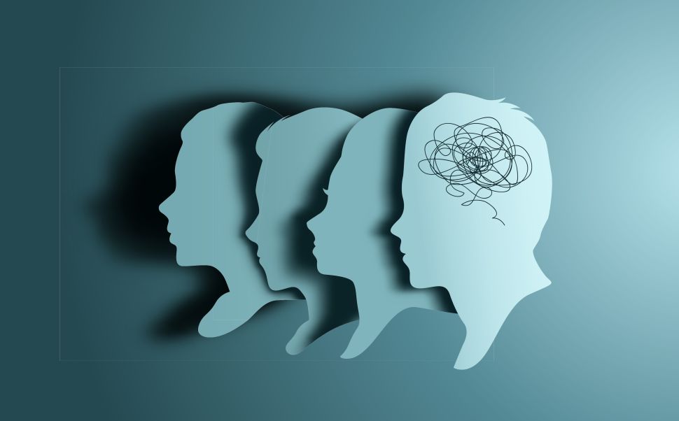 The outlines of four overlapping profiles, the right most one with scrambled lines in where their brain is